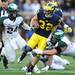 Michigan safety Jordan Kovacs is caught by Michigan State guard Jack allen after Kovacs intercepted the ball during the third quarter against Michigan State at Michigan Stadium on Saturday afternoon. Melanie Maxwell I AnnArbor.com